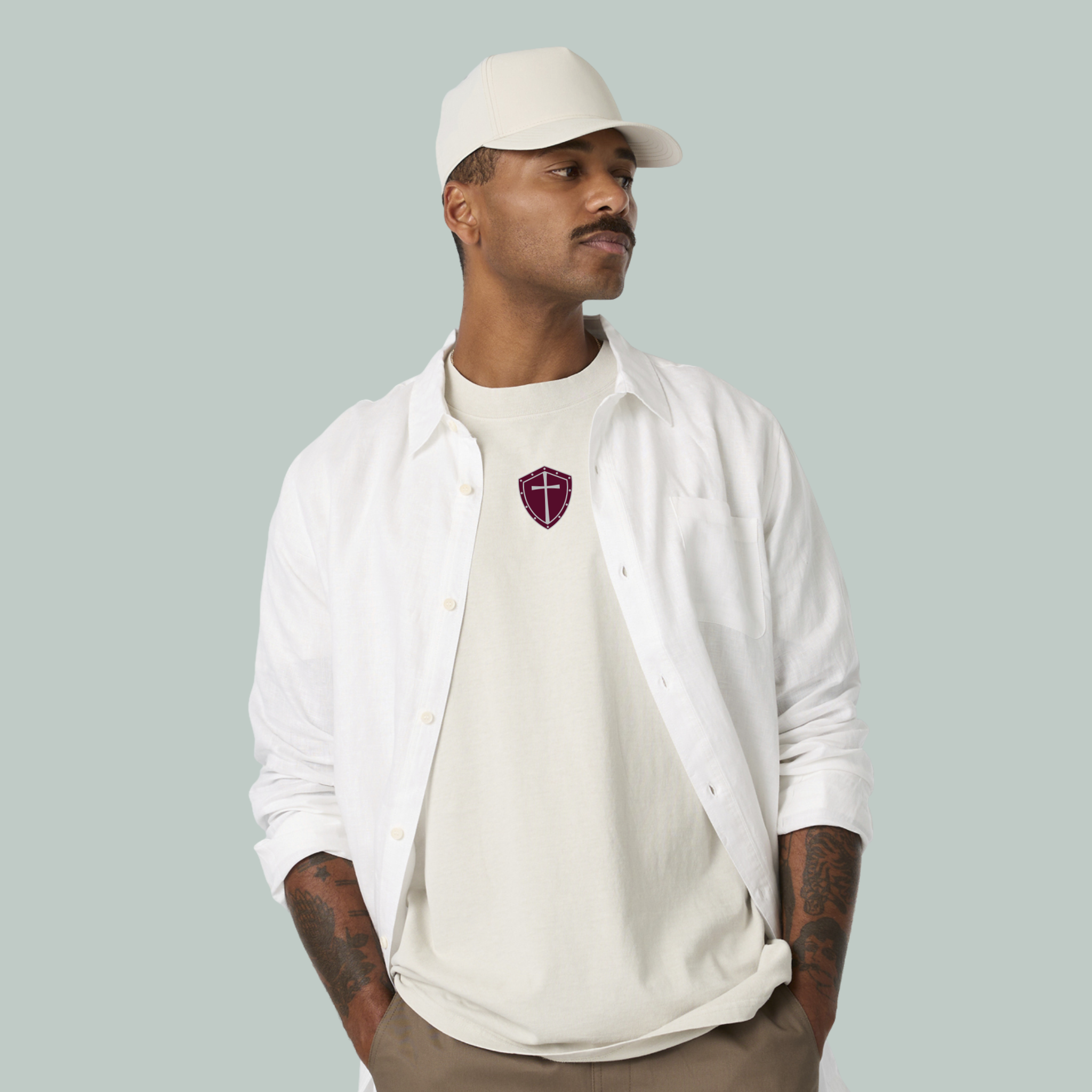 Women with tan bucket hat and Armor Up patch on center front area. 