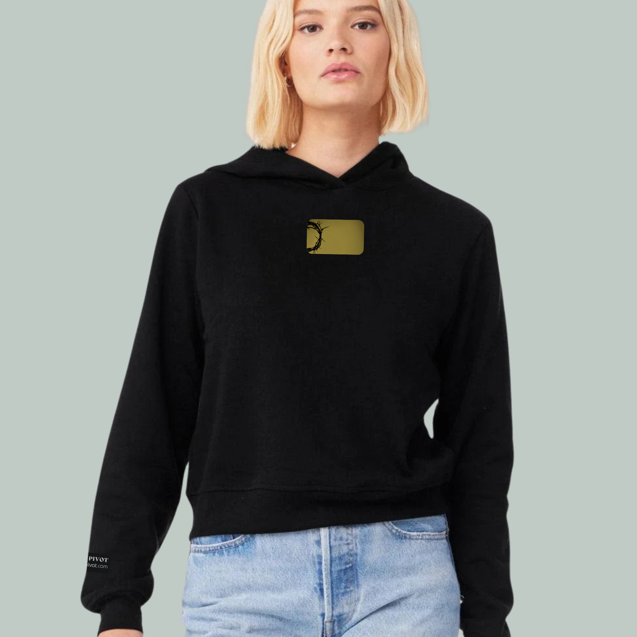 bone colored crop sweatshirt with redeemed embroidered on the front